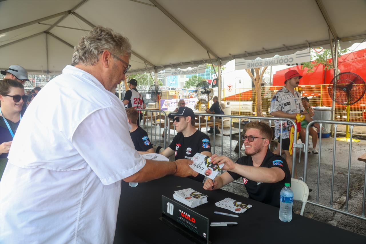 Reece Gold signs an autograph for a fan - INDY NXT By Firestone Music City Grand Prix - By: Travis Hinkle -- Photo by: Travis Hinkle