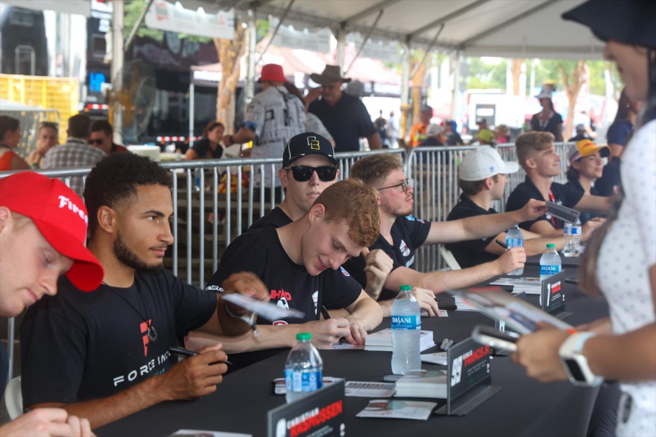 Josh Pierson signs an autograph for a fan - INDY NXT By Firestone Music City Grand Prix - By: Travis Hinkle -- Photo by: Travis Hinkle