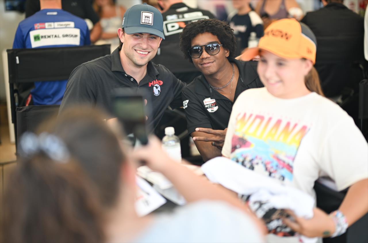 Nolan Allaer and Myles Rowe with a fan - INDY NXT by Firestone Music City Grand Prix - By: James Black -- Photo by: James  Black