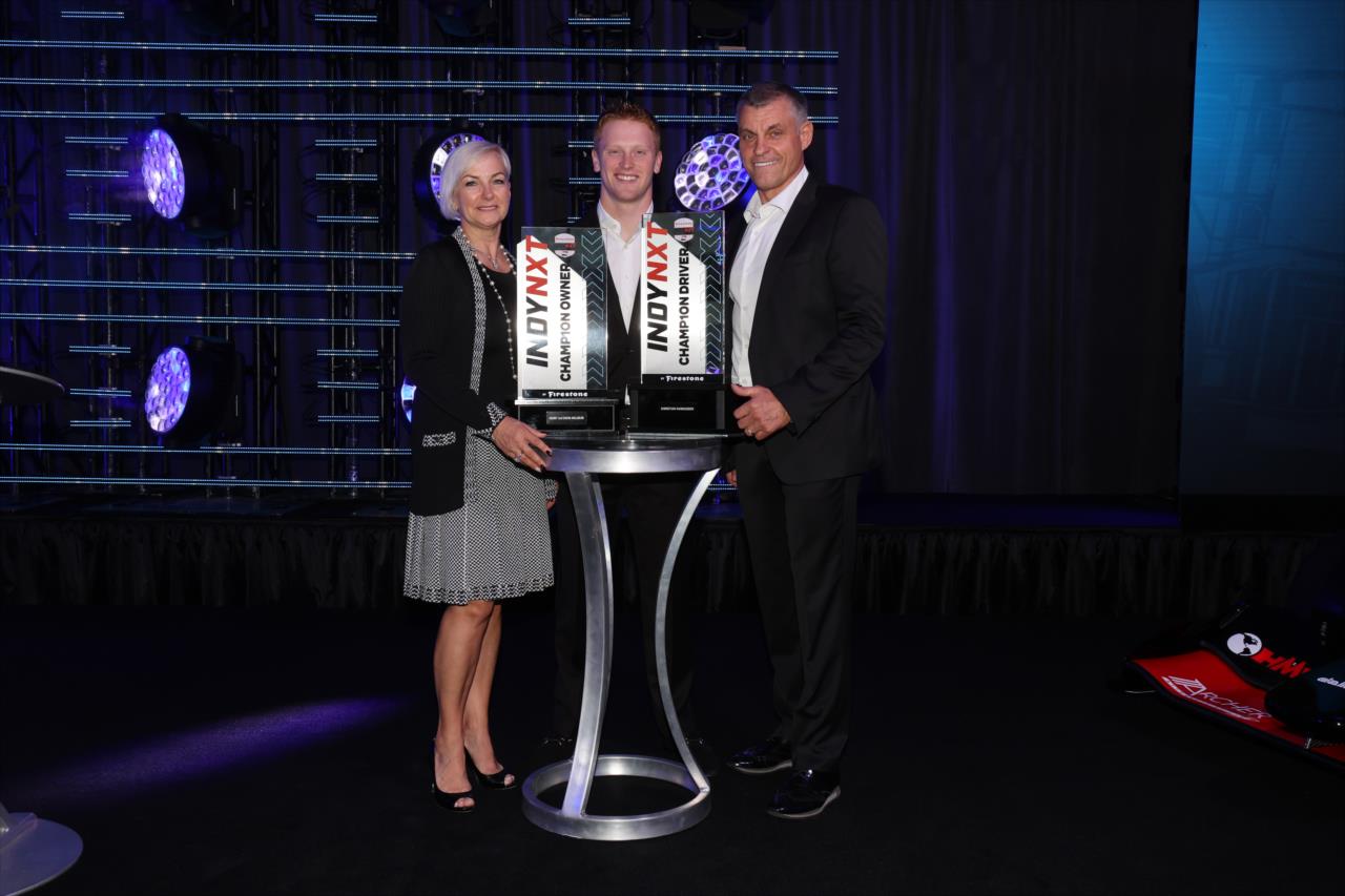 Christian Rasmussen with Henry and Daiva Malukas - 2023 NTT INDYCAR SERIES Championship Celebration - By: Chris Owens -- Photo by: Chris Owens