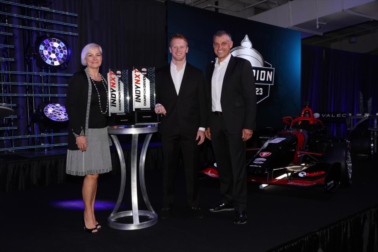 Christian Rasmussen with Henry and Daiva Malukas - 2023 NTT INDYCAR SERIES Championship Celebration - By: Chris Owens -- Photo by: Chris Owens