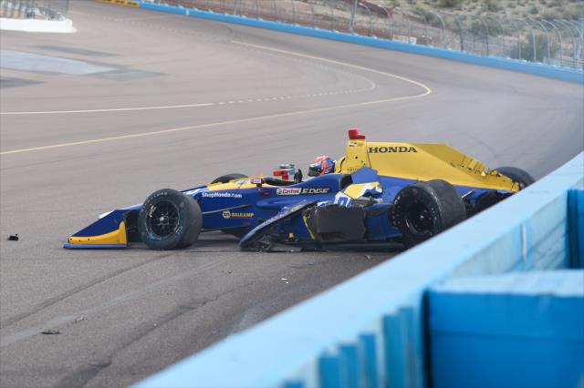 Alexander Rossi makes contact exiting Turn 2 during the Phoenix Open Test at Phoenix International Raceway -- Photo by: Chris Owens