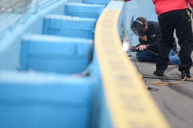 Repairs are made to the Turn 2 SAFER Barrier following contact during the Phoenix Open Test at Phoenix International Raceway -- Photo by: Chris Owens