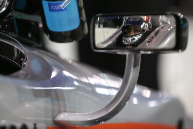 The reflection of Josef Newgarden through the rear view mirror on pit lane during the Phoenix Open Test at Phoenix International Raceway -- Photo by: Joe Skibinski