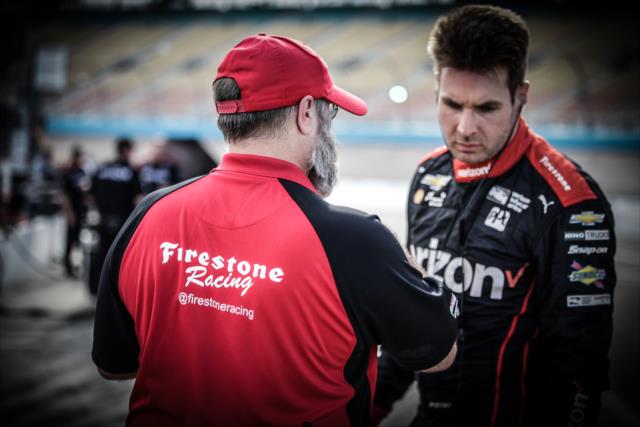 Will Power chats with a Firestone engineer on pit lane during the Phoenix Open Test at Phoenix International Raceway -- Photo by: Shawn Gritzmacher