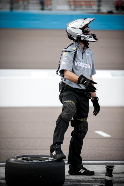A Team Penske crewman waits on pit lane during the Phoenix Open Test at Phoenix International Raceway -- Photo by: Shawn Gritzmacher
