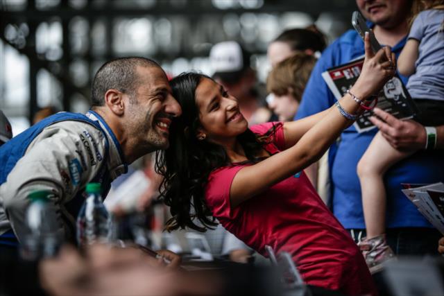 Tony Kanaan poses for a photograph during the autograph session in between test sessions at Phoenix International Raceway -- Photo by: Shawn Gritzmacher