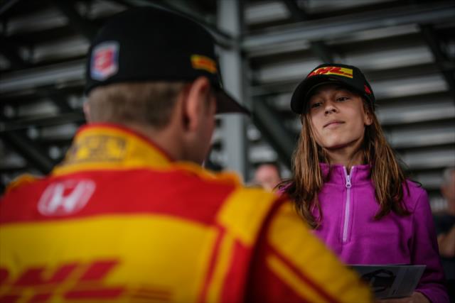 Ryan Hunter-Reay signs an autograph for a young fan during the autograph session in between test sessions at Phoenix International Raceway -- Photo by: Shawn Gritzmacher