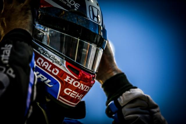 Graham Rahal slides on his helmet prior to the evening session during the Phoenix Open Test at Phoenix International Raceway -- Photo by: Shawn Gritzmacher