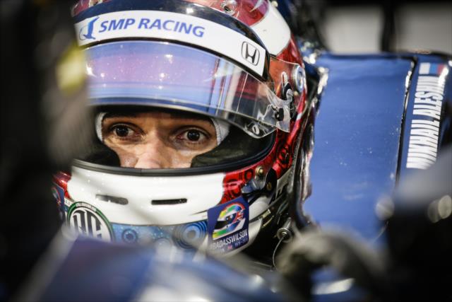 Mikhail Aleshin sits in his No. 7 SMP Honda on pit lane during the Phoenix Open Test at Phoenix International Raceway -- Photo by: Shawn Gritzmacher