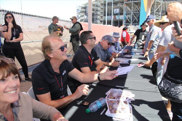 Arie Luyendyk signs an autograph during a legends autograph session at Phoenix Raceway -- Photo by: Richard Dowdy