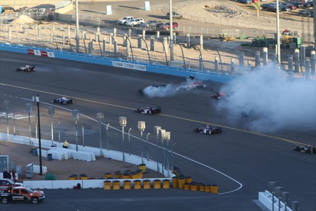 Cars slide in Turn 1 in the first lap incident during the Desert Diamond West Valley Phoenix Grand Prix -- Photo by: Richard Dowdy