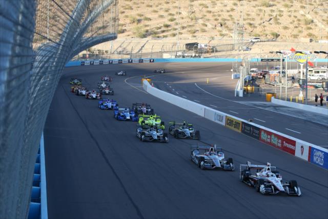 Helio Castroneves and Will Power lead the field to the green flag to start the Desert Diamond West Valley Phoenix Grand Prix -- Photo by: Chris Jones