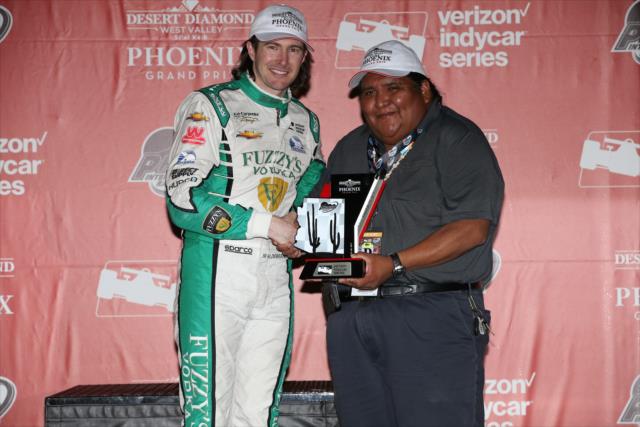 JR Hildebrand accepts his 3rd Place trophy in Victory Circle following the Desert Diamond West Valley Phoenix Grand Prix -- Photo by: Chris Jones