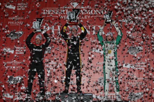 The confetti flies as Simon Pagenaud, Will Power, and JR Hildebrand hoist their trophies in Victory Circle following the Desert Diamond West Valley Phoenix Grand Prix -- Photo by: Chris Jones
