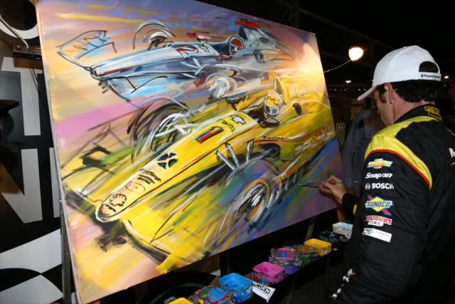 Simon Pagenaud signs a custom painting in Victory Circle after his victory in the Desert Diamond West Valley Phoenix Grand Prix at Phoenix Raceway -- Photo by: Chris Jones