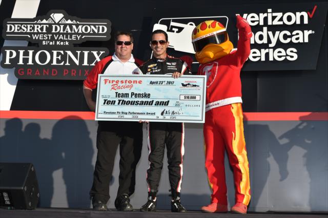 Helio Castroneves accepts the Firestone Pit Stop Performance Award on behalf of Team Penske for their performance at Barber Motorsports Park -- Photo by: Chris Owens