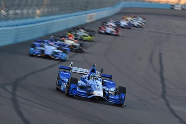 Tony Kanaan leads a train of cars into Turn 1 during the Desert Diamond West Valley Phoenix Grand Prix -- Photo by: Chris Owens