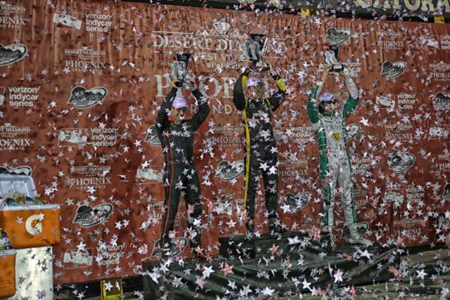 The confetti flies as Simon Pagenaud, Will Power, and JR Hildebrand hoist their trophies in Victory Circle following the Desert Diamond West Valley Phoenix Grand Prix -- Photo by: Richard Dowdy