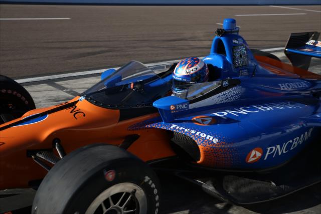 Scott Dixon sits in the No. 9 PNC Bank Honda on pit lane prior to the first on-track test of the windscreen at ISM Raceway -- Photo by: Chris Jones