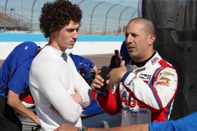 Tony Kanaan chats with Matheus 'Matt' Leist on pit lane during the rookie oval test at ISM Raceway -- Photo by: Chris Jones