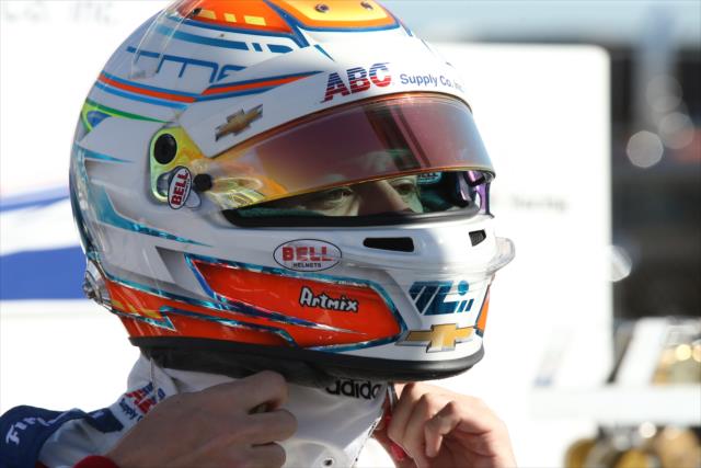 Matheus 'Matt' Leist straps on his helmet on pit lane prior to the start of the rookie oval test at ISM Raceway -- Photo by: Chris Jones