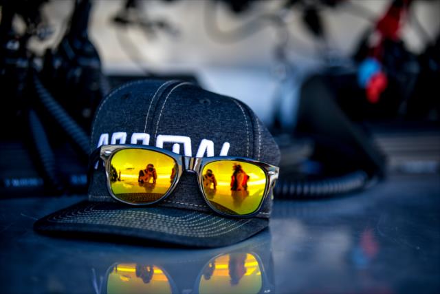 The hat & sunglasses of James Hinchcliffe along pit lane during the rookie oval test at ISM Raceway -- Photo by: Shawn Gritzmacher