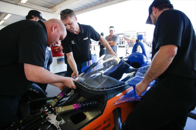 Chip Ganassi Racing technicians install a windscreen on the No. 9 PNC Bank Honda prior to the first on-track test at ISM Raceway -- Photo by: Shawn Gritzmacher