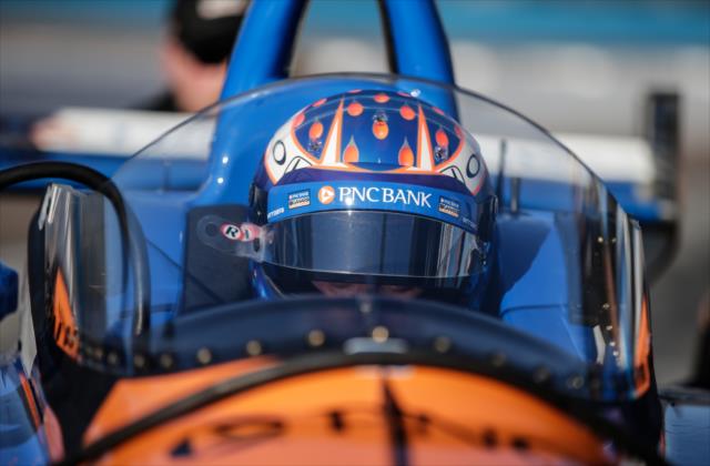 Scott Dixon sits in the No. 9 PNC Bank Honda on pit lane prior to the first oo-track test of the windscreen at ISM Raceway -- Photo by: Shawn Gritzmacher