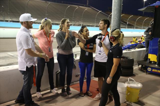 Conor Daly and members of The Amazing Race Season 30 are interviewed during the evening open test session at ISM Raceway -- Photo by: Chris Jones