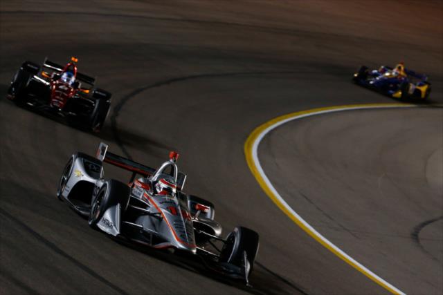 Will Power leads a group through Turn 1 during the evening open test session at ISM Raceway -- Photo by: Joe Skibinski