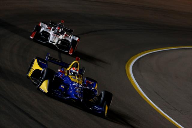Alexander Rossi and Marco Andretti sail through Turn 1 during the evening open test session at ISM Raceway -- Photo by: Joe Skibinski