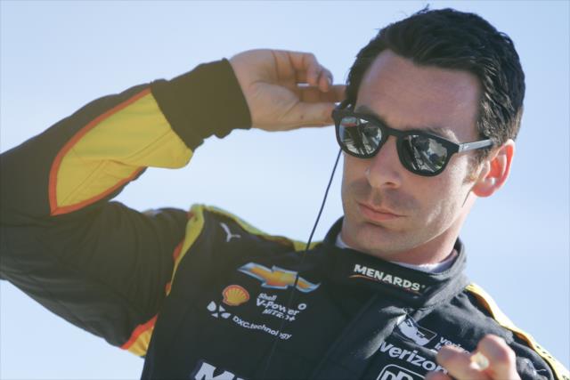 Simon Pagenaud sets his earpieces along pit lane prior to the afternoon open test session at ISM Raceway -- Photo by: Joe Skibinski