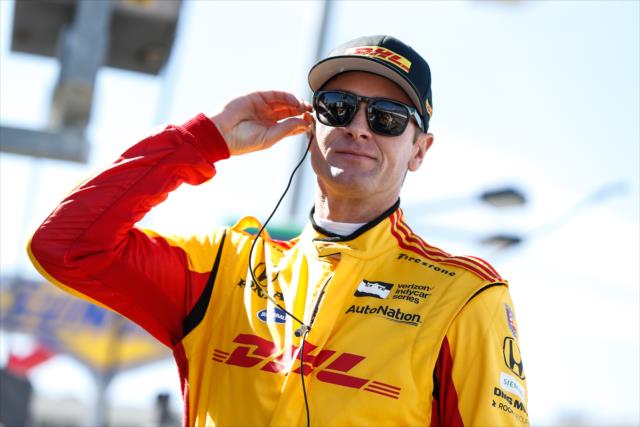Ryan Hunter-Reay sets his earpieces along pit lane prior to the afternoon open test session at ISM Raceway -- Photo by: Joe Skibinski