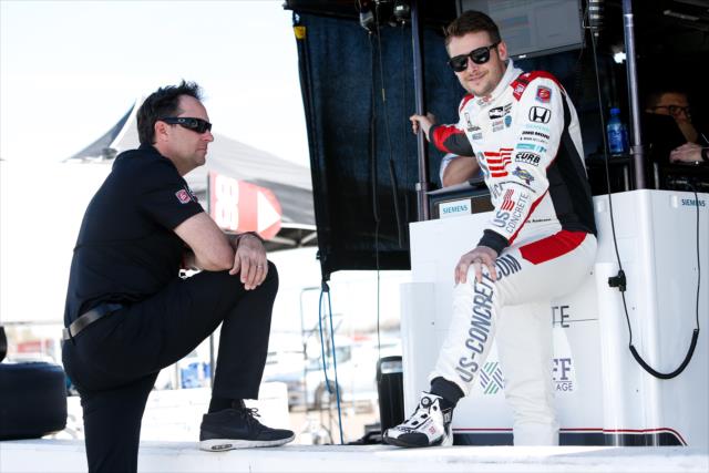 Marco Andretti and team co-owner Bryan Herta chat along pit lane during the afternoon open test session at ISM Raceway -- Photo by: Joe Skibinski