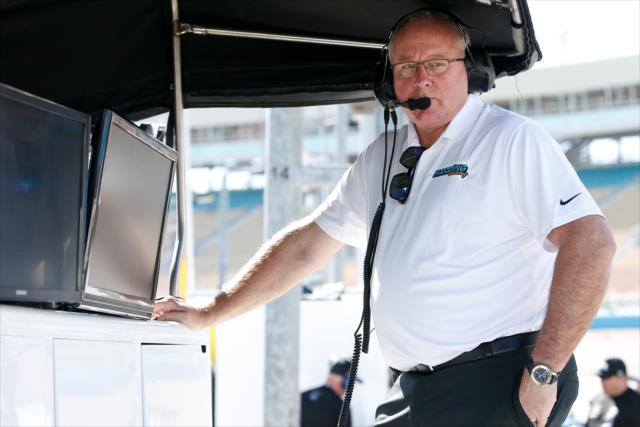 Team President Brian Barnhart watches track activity from the Harding Racing pit stand during the afternoon open test session at ISM Raceway -- Photo by: Joe Skibinski