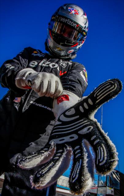 Josef Newgarden adjusts his gloves on pit lane prior to the start of the open test at ISM Raceway -- Photo by: Shawn Gritzmacher