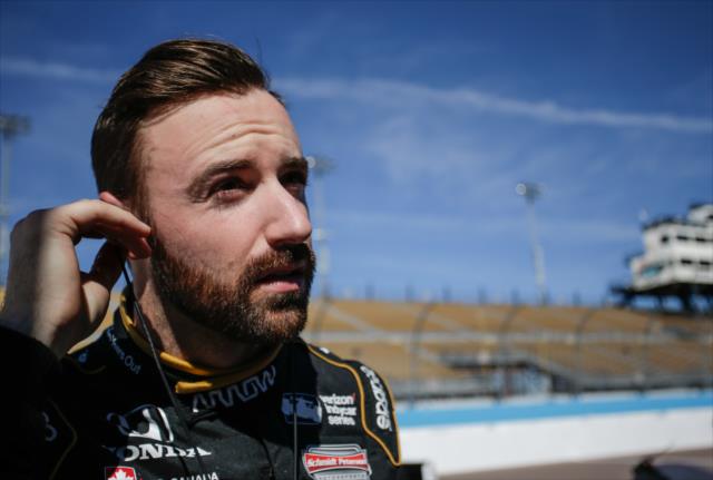 James Hinchcliffe sets his earpieces along pit lane prior to the start of the afternoon open test session at ISM Raceway -- Photo by: Shawn Gritzmacher