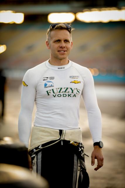 Ed Carpenter walks pit lane prior to the evening open test session at ISM Raceway -- Photo by: Shawn Gritzmacher