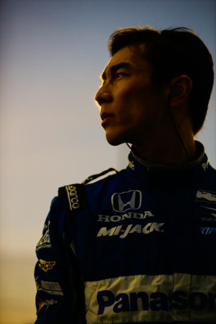 Takuma Sato looks down pit lane prior to the evening open test session at ISM Raceway -- Photo by: Shawn Gritzmacher