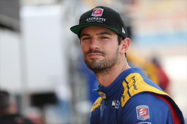 Alexander Rossi waits along pit lane prior to the start of the afternoon open test session at ISM Raceway -- Photo by: Chris Jones