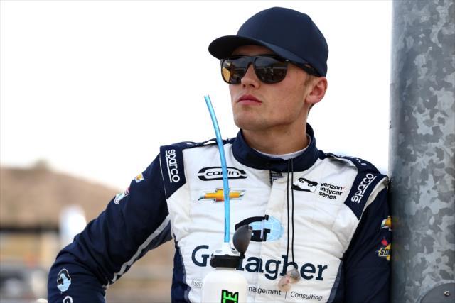 Max Chilton waits along pit lane prior to the evening open test session at ISM Raceway -- Photo by: Chris Jones