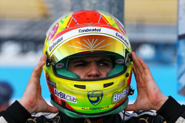 Pietro Fittipaldi slides on his helmet prior to the evening open test session at ISM Raceway -- Photo by: Chris Jones