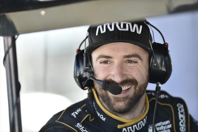 James Hinchcliffe chats with his engineers in his pit stand during the afternoon open test session at ISM Raceway -- Photo by: Chris Owens