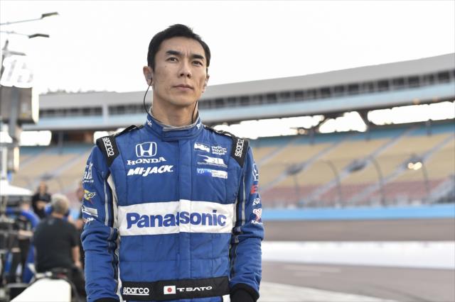 Takuma Sato looks down pit lane prior to the start of the evening open test session at ISM Raceway -- Photo by: Chris Owens