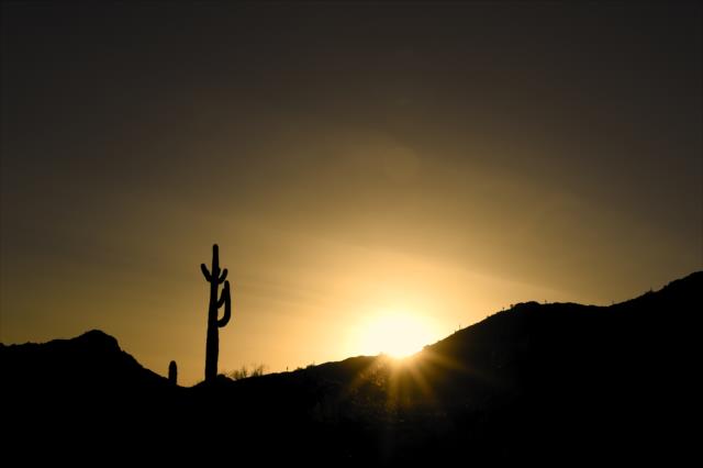 The sun sets over the mountains near ISM Raceway in Avondale, Arizona -- Photo by: Chris Owens