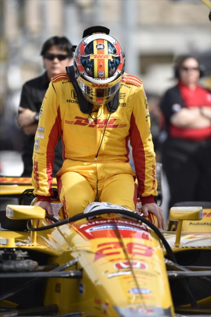 Ryan Hunter-Reay slides into his No. 28 DHL Honda on pit lane prior to the start of the afternoon test session at ISM Raceway -- Photo by: Chris Owens