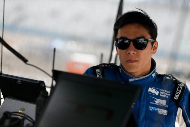 Takuma Sato reviews data in his pit stand during the afternoon open test session at ISM Raceway -- Photo by: Joe Skibinski