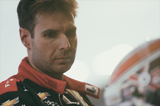 Will Power examines his helmet on pit lane prior to the evening open test session at ISM Raceway -- Photo by: Joe Skibinski