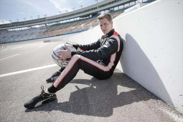 Josef Newgarden sits along pit lane prior to the start of the afternoon test session at ISM Raceway -- Photo by: Shawn Gritzmacher